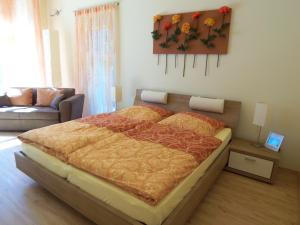 a bedroom with a large bed in a room at Badische Landoase in Kehl am Rhein