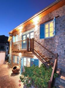 a stone house with a staircase on the side of it at “Imagine Renting this Luxury Villa” Troodos Mountains Home 119 in Kalopanayiotis