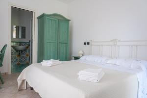 Postel nebo postele na pokoji v ubytování Il Melograno