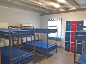 Postel nebo postele na pokoji v ubytování Albergue Orion