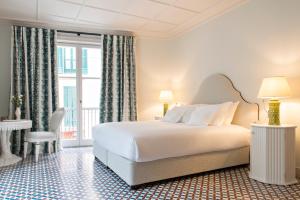 Postel nebo postele na pokoji v ubytování Hotel Cappuccino - Palma