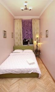 Postel nebo postele na pokoji v ubytování Kiev Centre Apartments