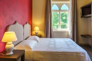 A bed or beds in a room at Relais La Placa