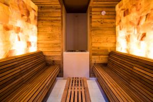 a room with a wooden floor and wooden walls at Hostellerie Des Châteaux & Spa in Ottrott