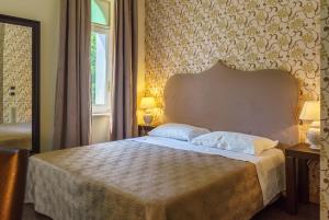 A bed or beds in a room at Relais La Placa