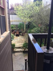 a view of a patio from the porch of a house at SWEET Suite BAKER Street in San Francisco