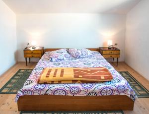 a bedroom with a bed and two night stands at Apartment Stana in Novi Vinodolski