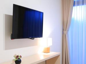 カモンイン 東寺東にあるテレビまたはエンターテインメントセンター