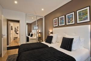 Łóżko lub łóżka w pokoju w obiekcie Central Apartment 127 by Saboia Collection