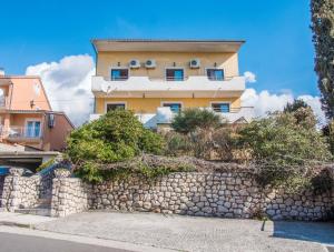 a building on top of a stone wall at Apartment Stana in Novi Vinodolski