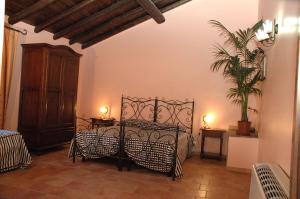 Postel nebo postele na pokoji v ubytování Agriturismo Borgo San Nicolao