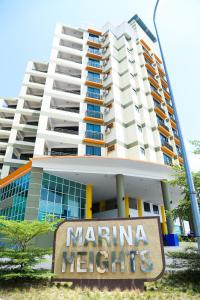 a building with a marina heights sign in front of it at Marina Heights Resort in Lumut