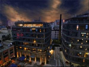 a view of a building in a city at night at Cachet Boutique Kunming Artime in Kunming
