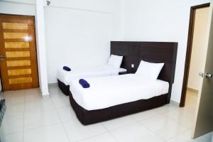 Postel nebo postele na pokoji v ubytování Marina Heights Resort