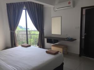 Postel nebo postele na pokoji v ubytování Marina Heights Resort
