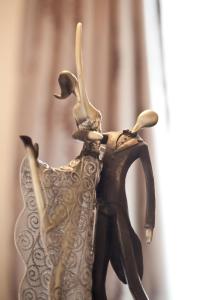 a figurine of a woman in a dress at Portland Apartments in Cheltenham