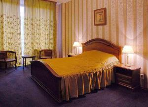 Кровать или кровати в номере Diplomat ApartHotel