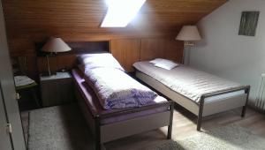 Postel nebo postele na pokoji v ubytování Pension Schlafstuhl