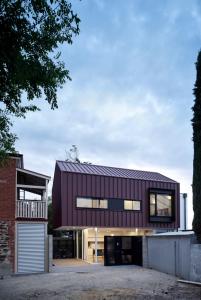 a modern house with a red roof at Swainson on Castle in Adelaide