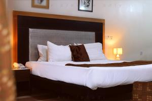 Postelja oz. postelje v sobi nastanitve BWC Hotel