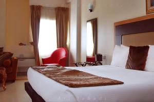 Postelja oz. postelje v sobi nastanitve BWC Hotel