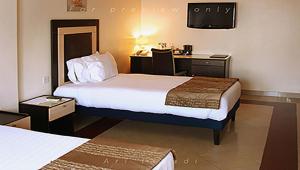 Postelja oz. postelje v sobi nastanitve BWC Hotel