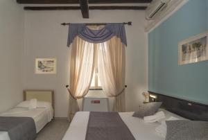 Postel nebo postele na pokoji v ubytování Hotel Amalfitana + 37 fotografií