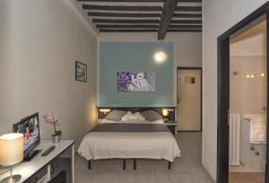 Postel nebo postele na pokoji v ubytování Hotel Amalfitana