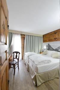 Postel nebo postele na pokoji v ubytování Mollino Rooms