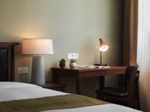 Letto o letti in una camera di Yusense Hotel