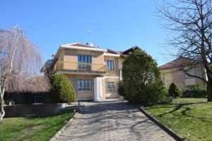 a large house with a driveway in front of it at I Ciliegi in Moncalieri