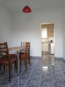 a dining room with a table and chairs at Pension Yasmine in Timişoara