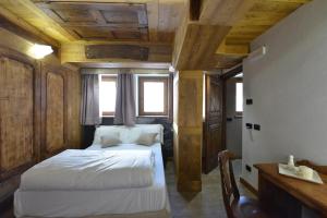 Postel nebo postele na pokoji v ubytování Mollino Rooms