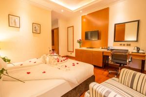 Postel nebo postele na pokoji v ubytování Alba Hotel Meru