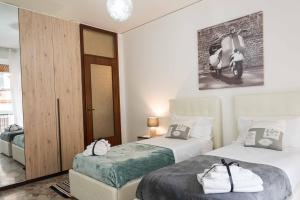 Kama o mga kama sa kuwarto sa Gabrielli Rooms & Apartments - FIERA