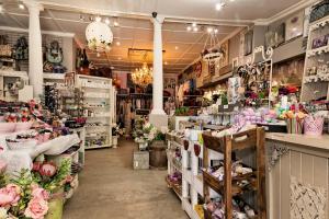 a store filled with lots of flowers and other items at De Loft Guesthouse in Piet Retief
