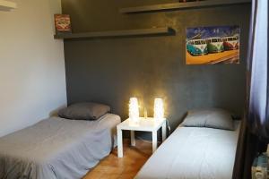 Katil atau katil-katil dalam bilik di Appartement Janas , Haut de villa 90m2