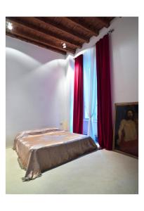 Posteľ alebo postele v izbe v ubytovaní CasaM Charme&Relax