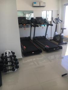 a gym with two treadmills and a treadmill at Departamento en Palermo Soho in Buenos Aires