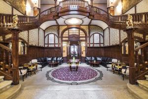 a lobby with a large room with chairs and a table at Rubezahl-Marienbad Luxury Historical Castle Hotel & Golf-Castle Hotel Collection in Mariánské Lázně