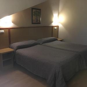 Postel nebo postele na pokoji v ubytování Hotel Avenida Leganés