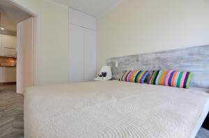 Katil atau katil-katil dalam bilik di Victus Apartamenty, Apartamenty Cztery Oceany