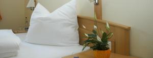 Postel nebo postele na pokoji v ubytování Gasthaus Gumping