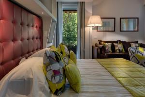 Postel nebo postele na pokoji v ubytování Hotel Hermitage
