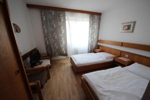 Postelja oz. postelje v sobi nastanitve Hotel Kleinmünchen