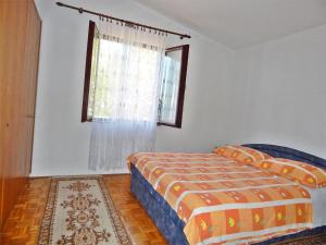 Postel nebo postele na pokoji v ubytování Apartment Kovačić