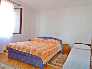Postel nebo postele na pokoji v ubytování Apartment Kovačić