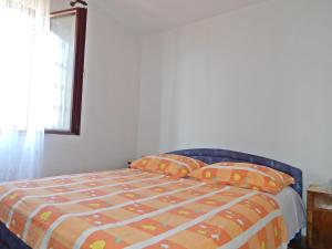 Postel nebo postele na pokoji v ubytování Apartment Kovačić