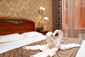 Cama o camas de una habitación en Boutique Hotel Rozhdestvensky Dvorik