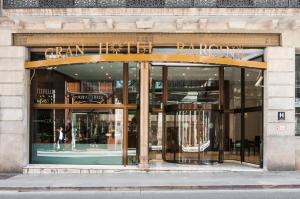a store front of a building with glass windows at Gran Hotel Barcino 4 Sup in Barcelona